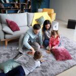 A plush 2x6 feet AROGAN runner rug in grey and white with a textured rainbow pattern, suitable for a child's room.