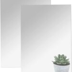 Two rectangular 16x12 inch DARENYI acrylic mirror sheets with adhesive backing, reflecting a room interior.