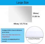 Two rectangular 16x12 inch DARENYI acrylic mirror sheets with adhesive backing, reflecting a room interior.