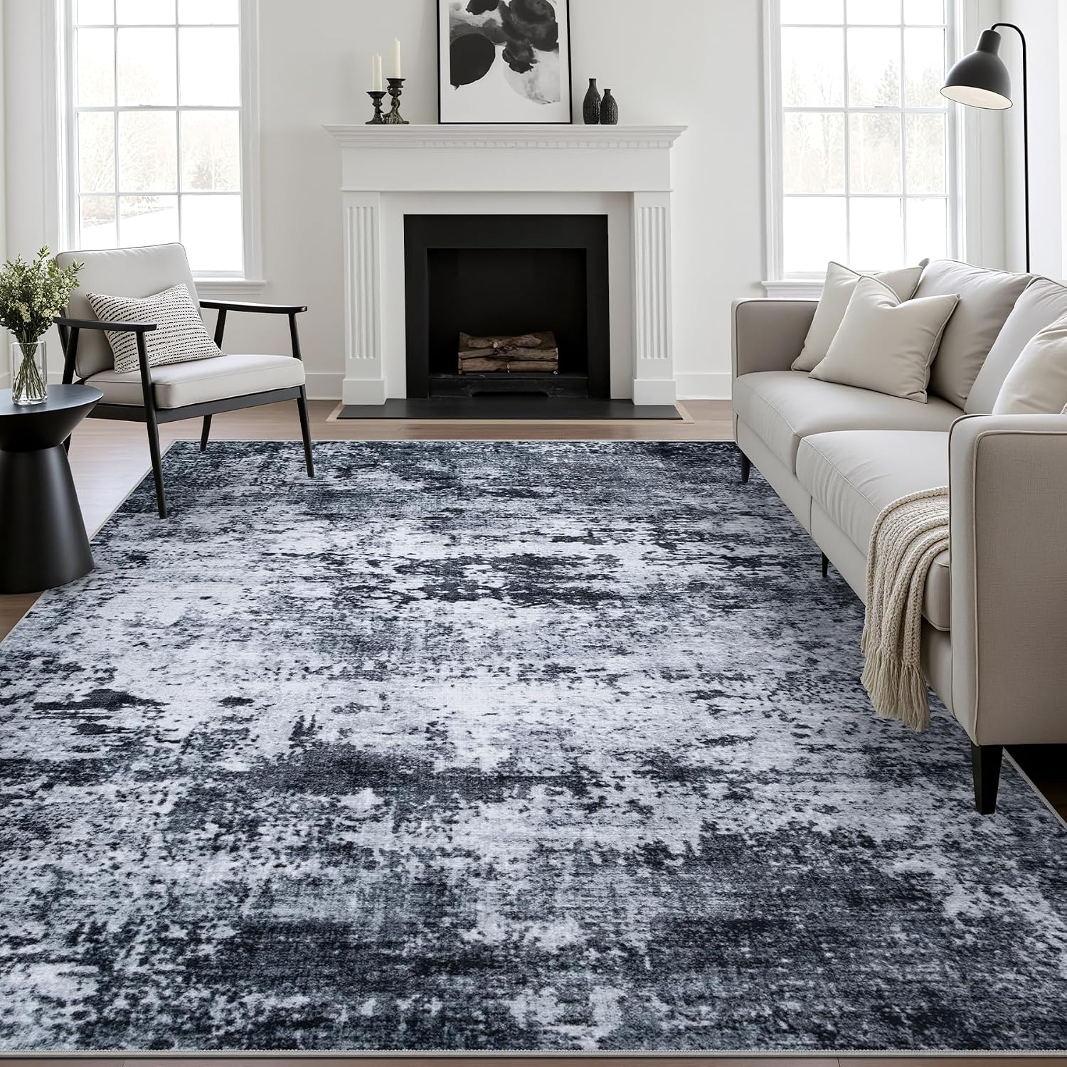 fxrhlp-5x7-modern-abstract-black-washable-area-rug-for-living-room-01 A black 5x7 modern abstract area rug with subtle patterns, laid out in a living room setting.