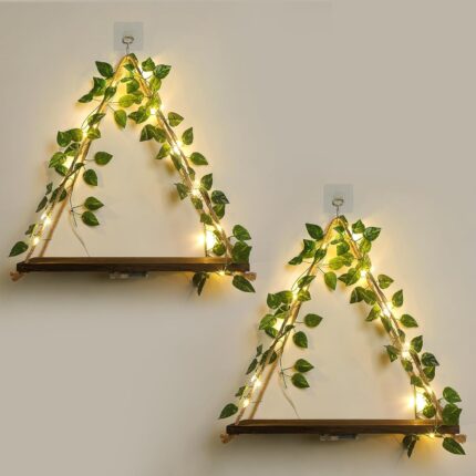 A set of two JOPSTDI White Flower floating triangle shelves with artificial ivy and LED lights, mounted on a wall.