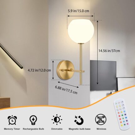 Two gold battery-operated wall sconces with milky white frosted glass shades mounted on a wall, illuminated with a warm glow.