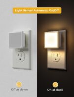 Two L LOHAS LED square plug-in night lights with a glossy white finish, emitting a soft glow.