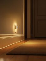 Two L LOHAS LED square plug-in night lights with a glossy white finish, emitting a soft glow.