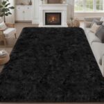 A black 8x10 Luxturiy fluffy shag area rug, shown spread out on a floor in a modern living room setting.