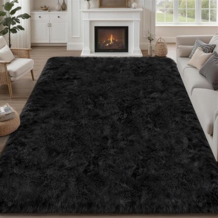 A black 8x10 Luxturiy fluffy shag area rug, shown spread out on a floor in a modern living room setting.