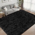 A luxurious black fluffy shag area rug, 5x7 feet, with a thick, soft pile, perfect for a living room or bedroom.