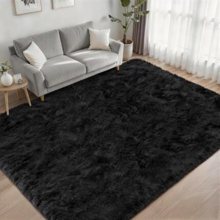 A luxurious black fluffy shag area rug, 5x7 feet, with a thick, soft pile, perfect for a living room or bedroom.