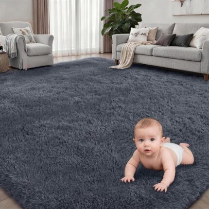 A soft, plush grey 8x10 shag area rug from Luxturiy, laid out in a modern living room setting.