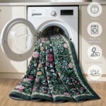 A dark green 8x10 area rug with a vintage floral pattern, suitable for a living room or bedroom.