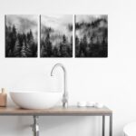 Three vertical panels of TYTAUPT black and white foggy forest canvas art, each 12x16 inches, hanging on a wall