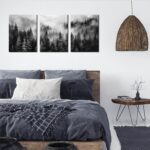 Three vertical panels of TYTAUPT black and white foggy forest canvas art, each 12x16 inches, hanging on a wall