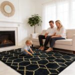 An 8x10 yulidayang black and gold geometric shag area rug with a high, fluffy pile, laid out on a floor.